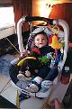 Alex's car seat strapped to the dinette - Click for Enlarged Image